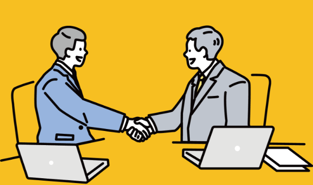 スーツ姿の男性が握手